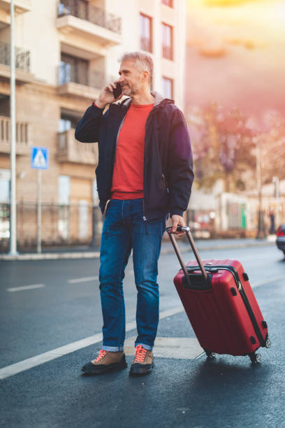 istock businessman with suitcase walking  in a city. 1138611315