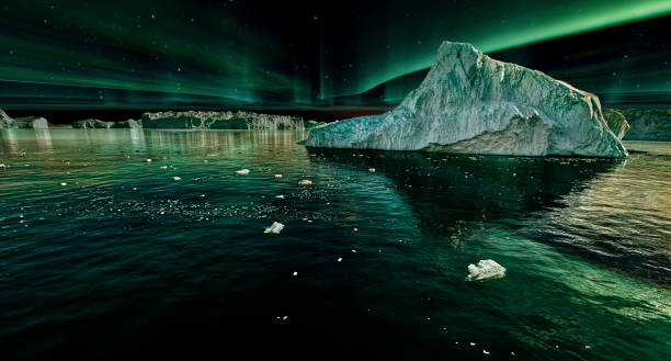 iceberg floating in greenland fjord at night with green northern lights stock photo