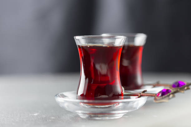 istock Red tea in turkish glasses on a wooden table 1138615742