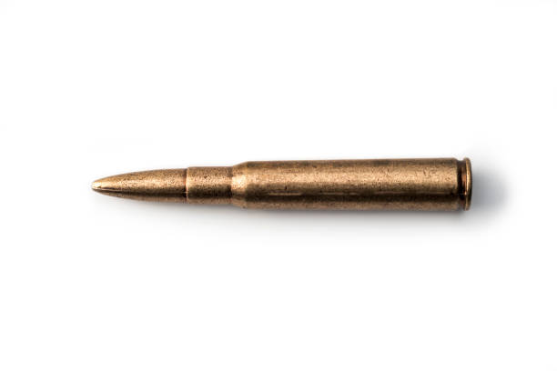 one Rifle cartridge on white One rifle bullets ammunition on White Background ak 47 bullets stock pictures, royalty-free photos & images