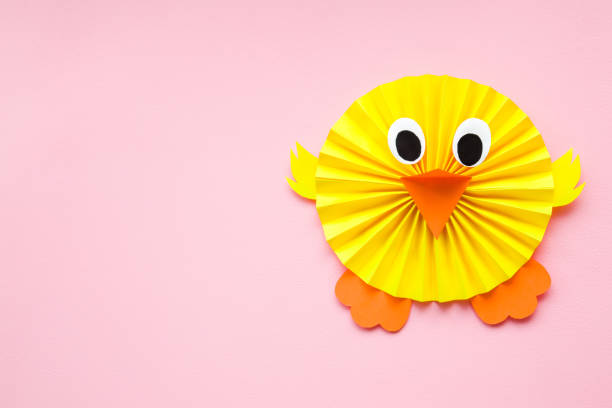 istock Happy, cute, yellow chick folded and created from paper on pastel pink background. Empty place for positive, lovely text, quote or sayings. Top view. 1138617724