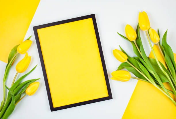 istock Decorative empty frame with copy space and bouquet of tulips 1138618969