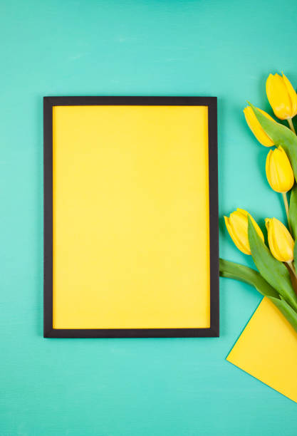 istock Decorative empty frame with copy space and bouquet of tulips 1138618971