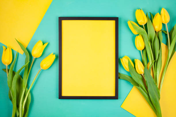 istock Decorative empty frame with copy space and bouquet of tulips 1138618977