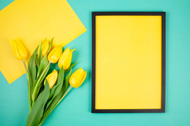 istock Decorative empty frame with copy space and bouquet of tulips 1138618979