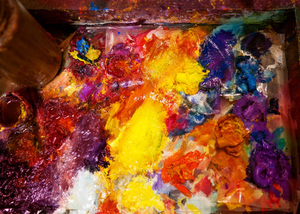 istock artist paints oil palette 1138619426