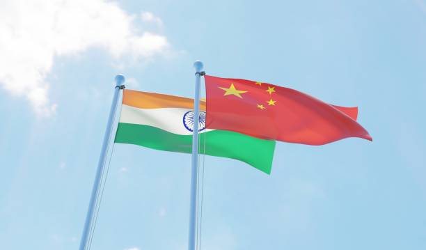 istock India and China, two flags waving against blue sky 1138620619