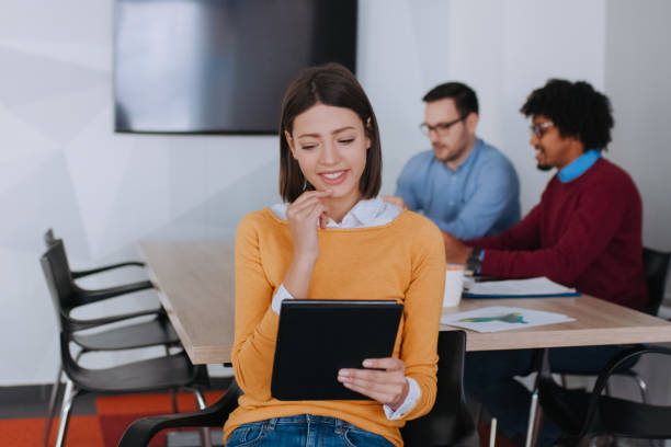 istock Young businesswoman using digital tablet in the office 1138625824