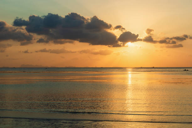 istock Golden sunset sunset over calm sea ocean waves 1138627968