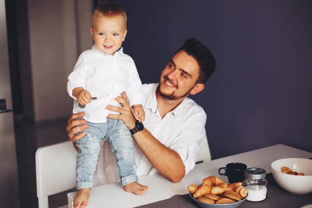 istock Father with son at home 1138630078
