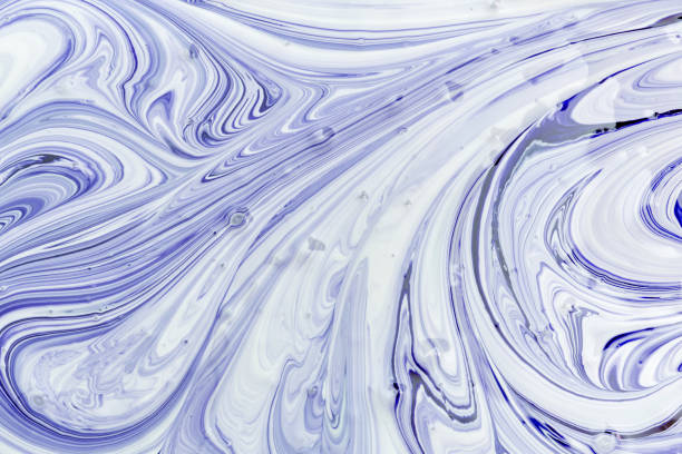 istock The process of mixing white and blue paint close-up. Empty abstract background for layouts. 1138630396