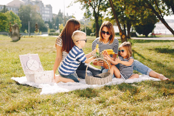 istock Mothers with kids playing in a summer park 1138630995