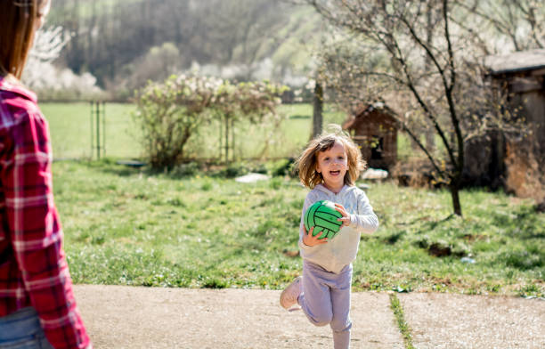 istock Little girl with ball 1138633604