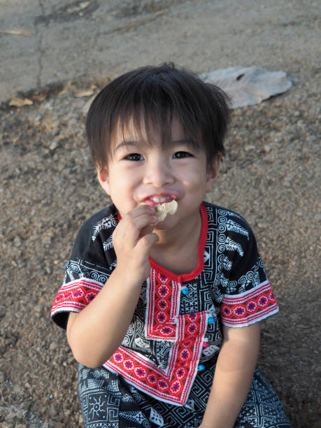 istock The boy is eating a crispy snack. 1138635019