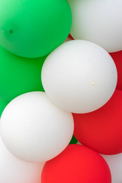 istock Many colorful balloons decorated wall as background 1138635437