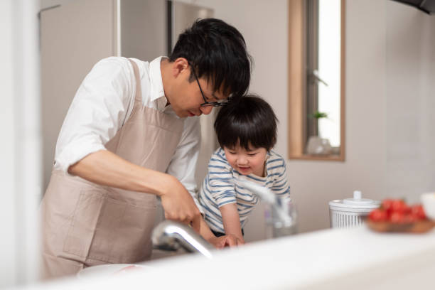 istock Father showing his son how to cook 1138635533