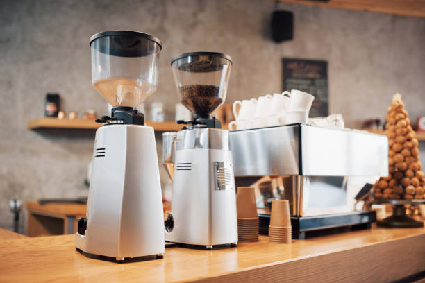 Professional black electric grinder is on a wooden table