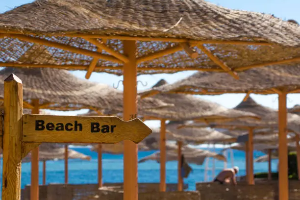 Wooden sign at the beach: Beach Bar
