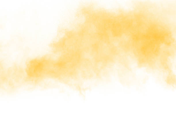 istock Yellow  color powder splatter on white background. Color particles splash. 1138637066
