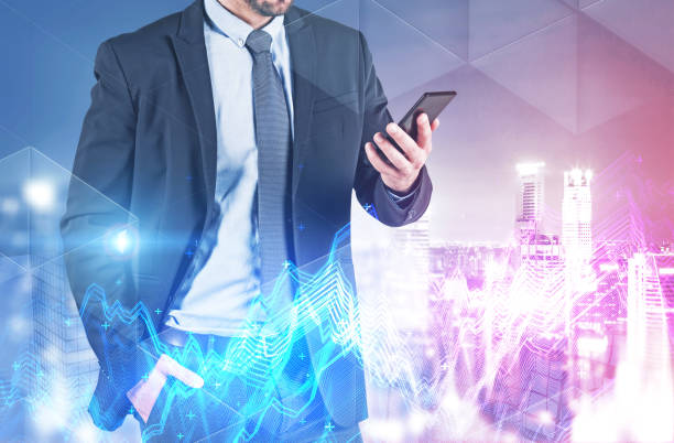 istock Man looking at phone in night city, graphs 1138637290