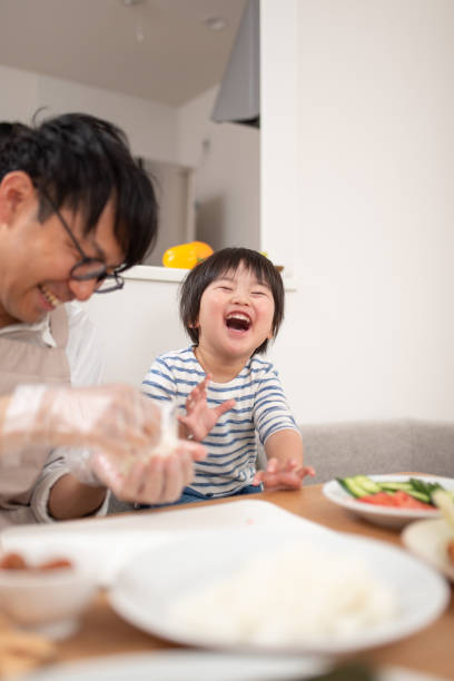 istock Father and son cooking rice ball 1138637795