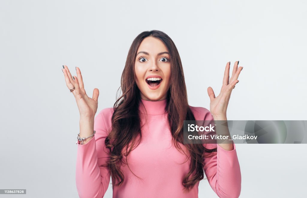 Surprised amazing woman isolated on white background Surprised amazing woman isolated on white background. Happiness and excitement concept Women Stock Photo