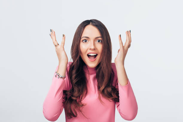 istock Surprised amazing woman isolated on white background 1138637836