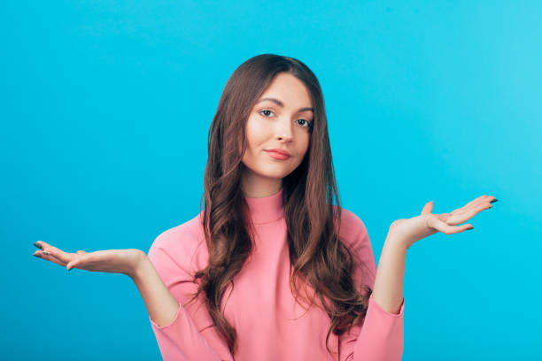 istock Confused doubtful woman isolated on blue background 1138637895