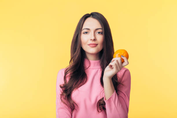 5,600+ Woman Tangerine Stock Photos, Pictures & Royalty-Free