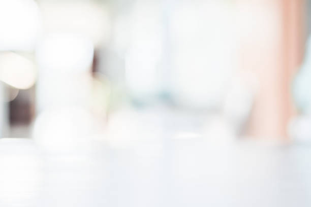 istock Abstract blurred gray and white bokeh background on top table for backdrop or logo or text composition for magazine or graphic design background 1138637945