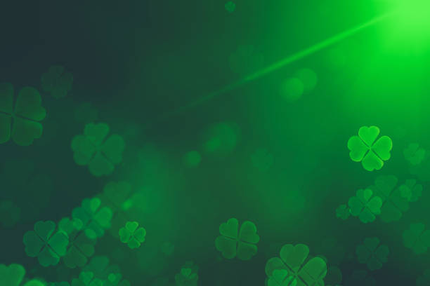 St. Patrick's Day green Shamrock Leaves background. Patrick's Day backdrop with growing clover leaf extreme close-up. Patrick Day pub party background stock photo