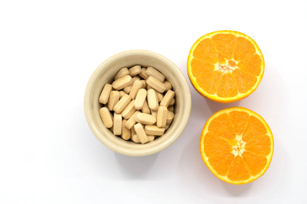 pot of vitamin c tablets stock photo