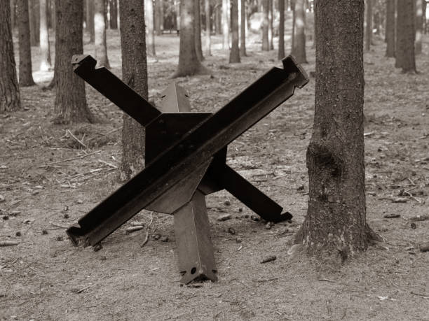 Iron anti-tank barrier from World War II. Retro sepia style image.