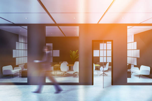 istock Man near black and white meeting room with sofa 1138639449