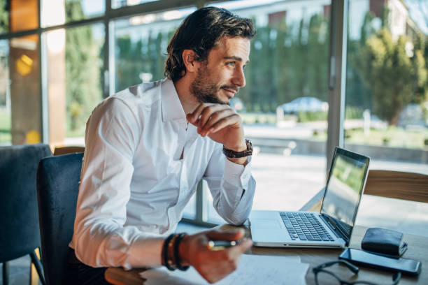 istock Man working on laptop in cafe 1138639485