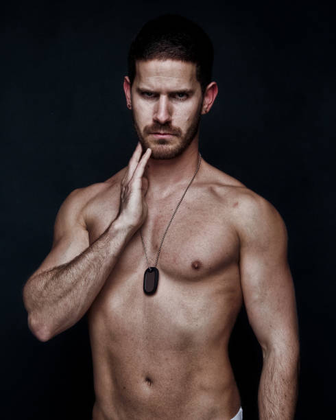 istock Sexy man wearing a dogtag and white underwear 1138641555