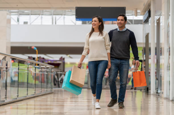 istock Happy couple shopping at the mall 1138641596