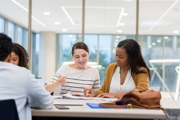 istock College friends work on project together 1138642656