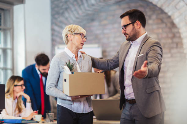 elderly employee leaving office with box full of belongings. time to retire - credit crunch audio imagens e fotografias de stock