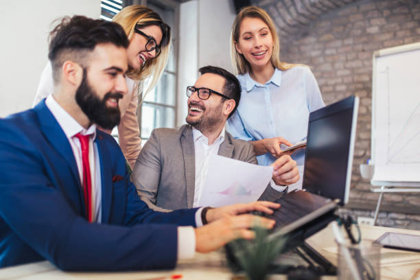 istock Business people working in office together. Team work in office. 1138644333