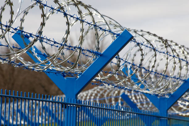 fence with barbed wire stock photo