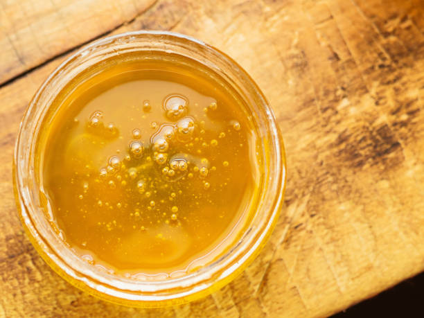 istock honey with air bubbles top view 1138644715