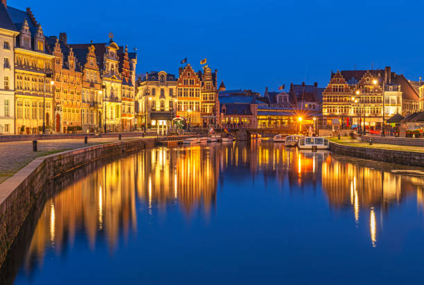 Cityscape of Ghent during the Blue Hour, Belgium Cityscape of Ghent (Gent) city during the blue hour with its historic flemish guild houses having a reflection in the Leie river, East Flanders, Belgium. dutch guilders stock pictures, royalty-free photos & images