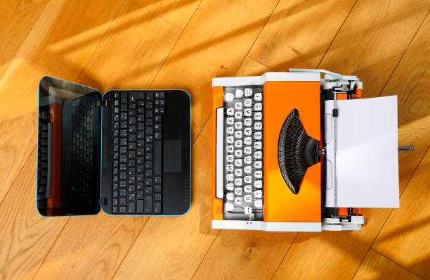istock Digital and analog – Laptop and 70s Typewriter 1138646448