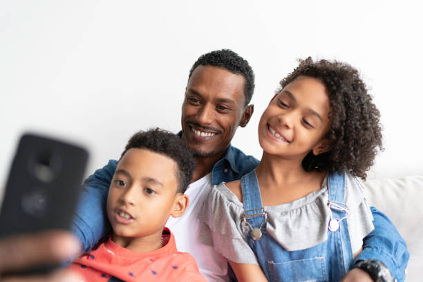 istock Afro Latin Family taking a selfie at Home 1138646574