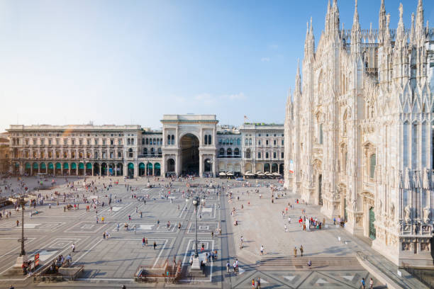 Piazza Duomo, Milan, Italy MILANO, ITALY - 31 Aug 2016: Piazza Duomo square with the Duomo cathedral and Vittorio Emanuele II shopping gallery in Milan, Italy. museo stock pictures, royalty-free photos & images