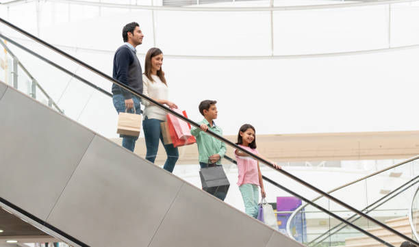 istock Happy family using the escalators at the mall 1138649794