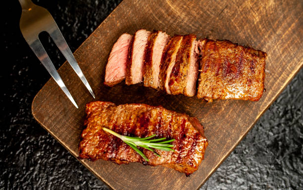 istock Beef steak on the cutting board with spices 1138650444