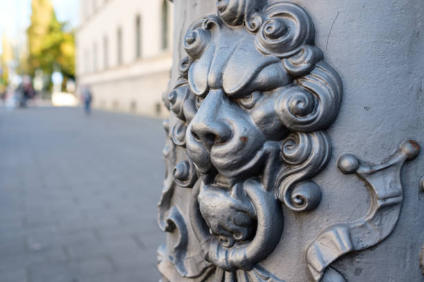 istock Cast iron lion head with ornamentation painted with rust protection paint 1138650449