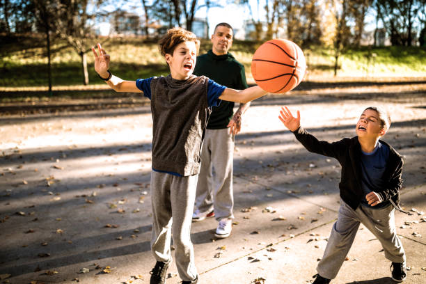 istock With father on basketball field 1138651752